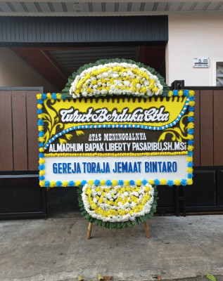 Papan Bunga Duka di Wonawa